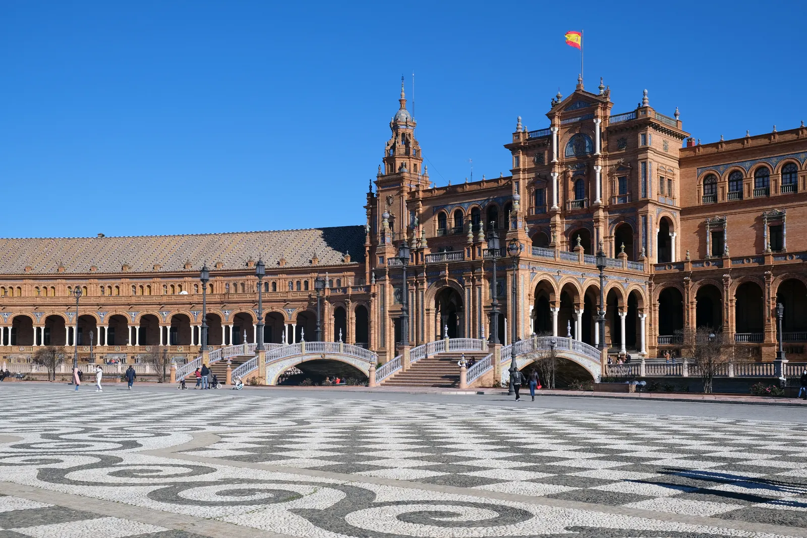 Plaza de España in Seville, with its brick towers, arcades and tiled bridges over the canal